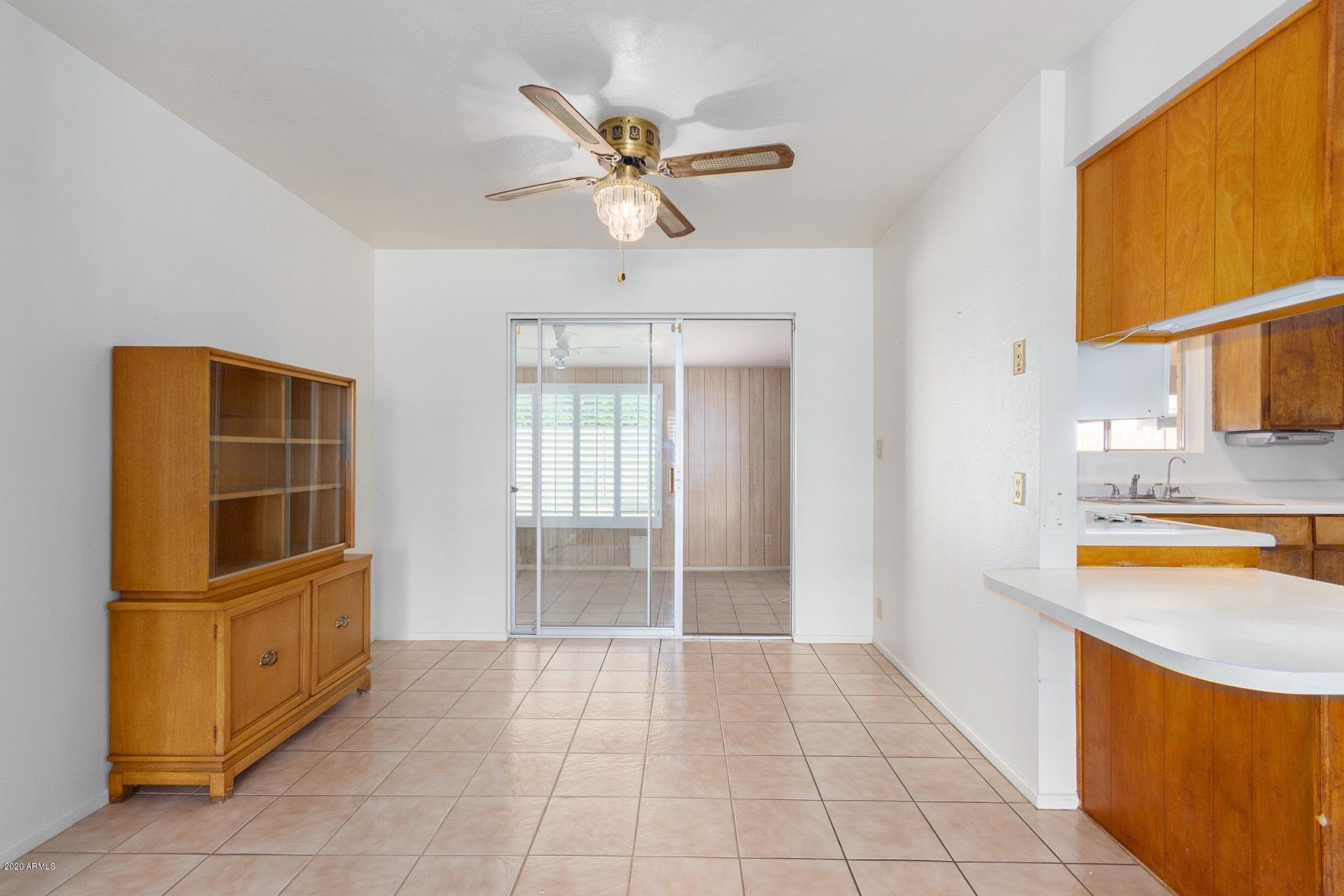 5704 East Decatur Street Mesa, AZ 85205 - Photo 27 of 40 a view of a kitchen with a sink and a refrigerator