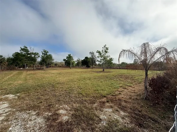 a view of a lake with a big yard