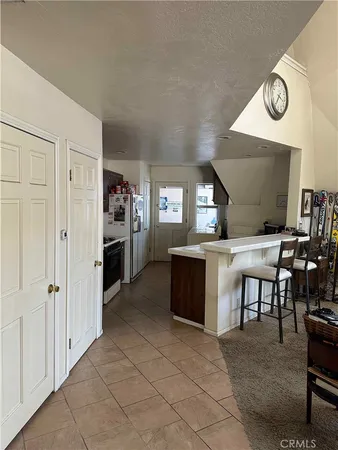 a view of a kitchen and dining area