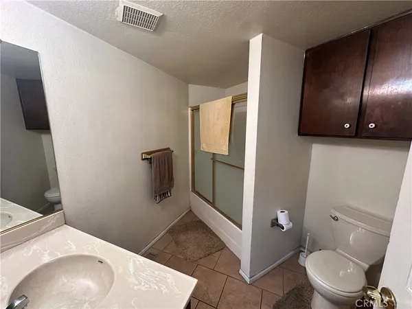 a bathroom with a toilet and a sink