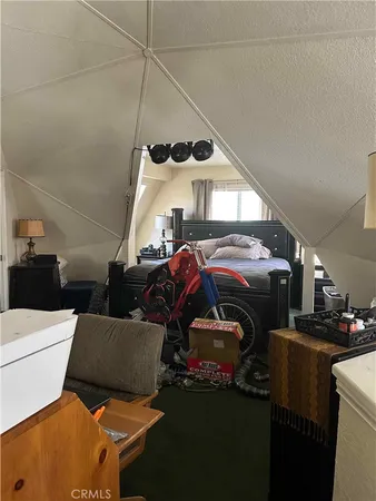 a bedroom with bed and window