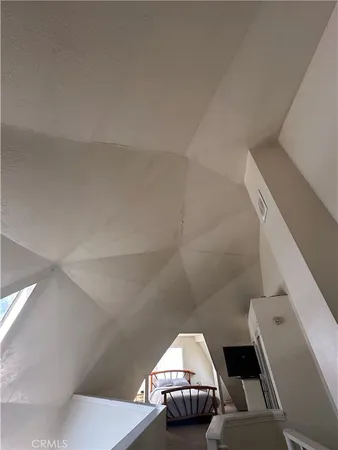 a view of roof deck with furniture