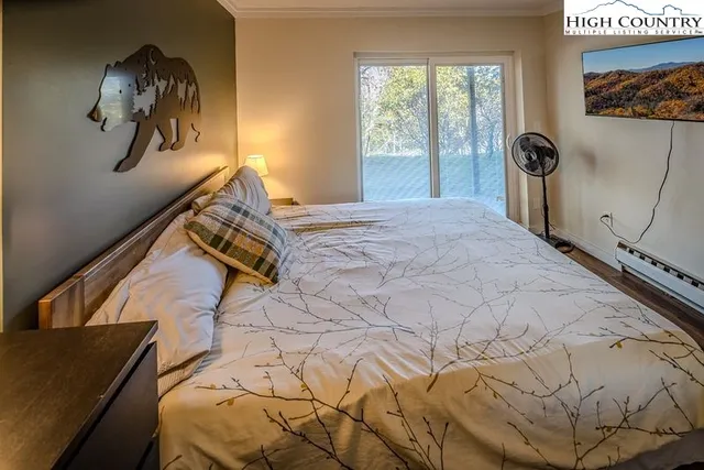 a bed sitting next to a window