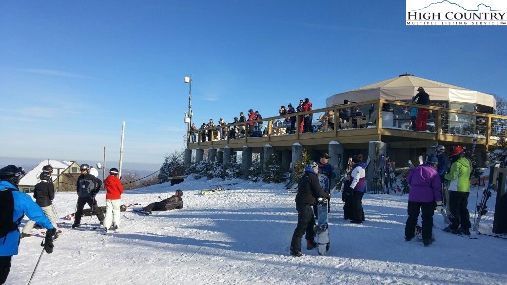 115 North Pinnacle Ridge Road, Unit 47 Beech Mountain, NC 28604 - Photo 25 of 33 a group of people standing around a store