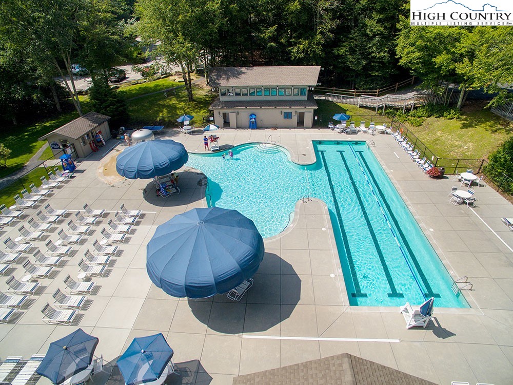115 North Pinnacle Ridge Road, Unit 47 Beech Mountain, NC 28604 - Photo 29 of 33 a view of backyard with swimming pool and outdoor seating