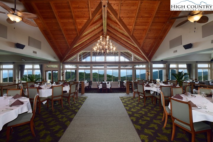 115 North Pinnacle Ridge Road, Unit 47 Beech Mountain, NC 28604 - Photo 30 of 33 a living room with lots of furniture and a chandelier