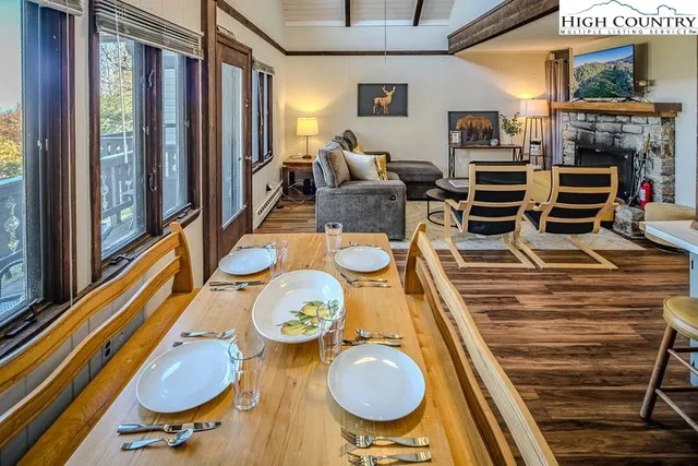 a dining room with furniture and wooden floor