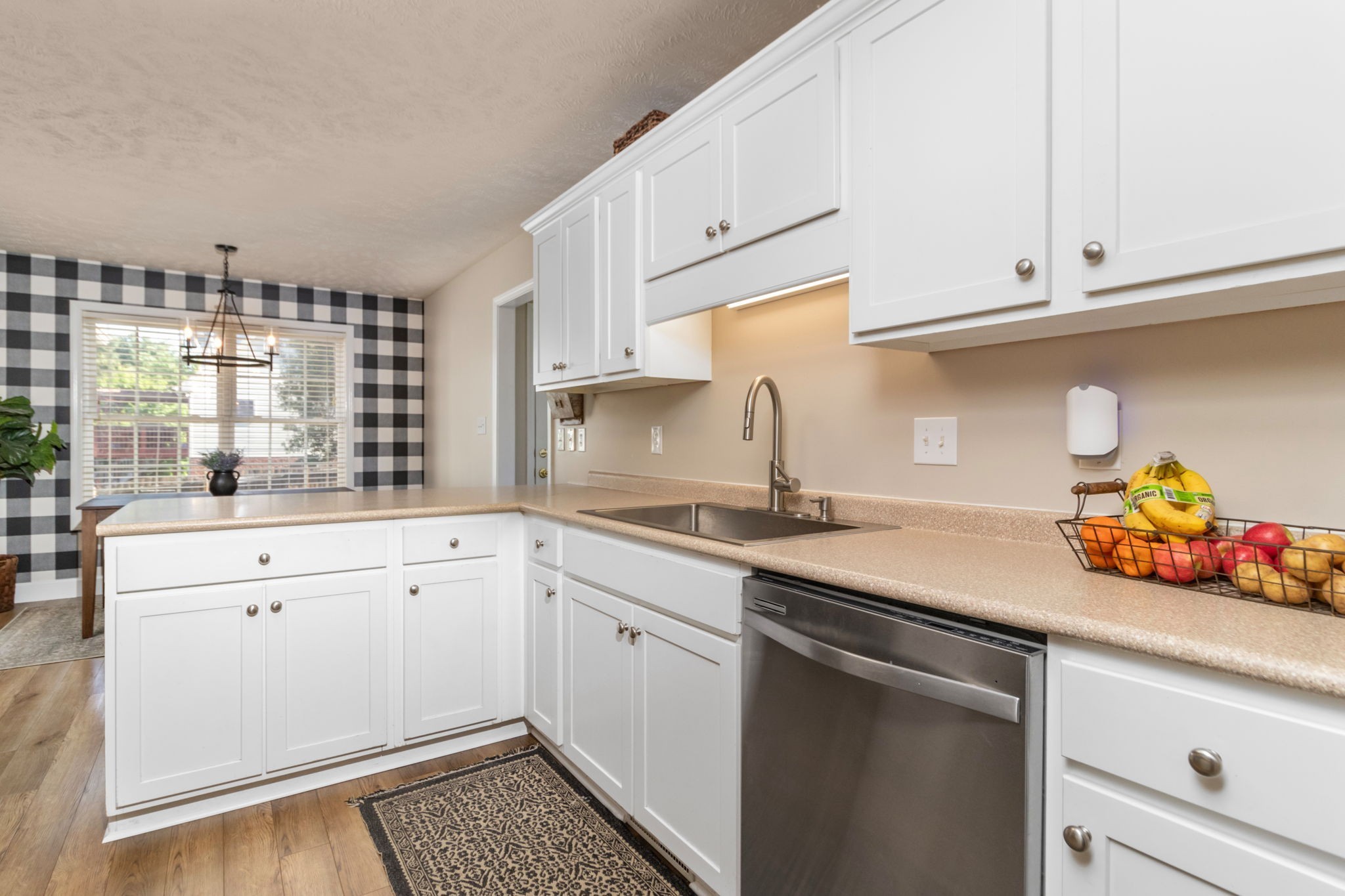 3572 Rabbit Run Trail Adams, TN 37010 - Photo 10 of 44 a kitchen with stainless steel appliances granite countertop a sink and cabinets
