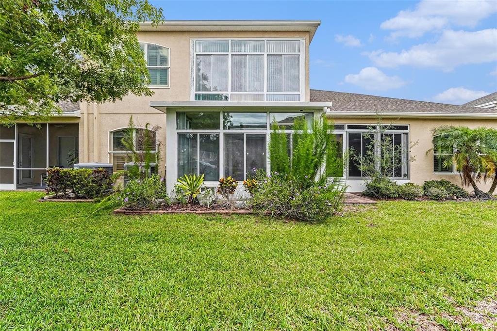 7411 Wimpole Drive New Port Richey, FL 34655 - Photo 19 of 21 front view of a house with a yard