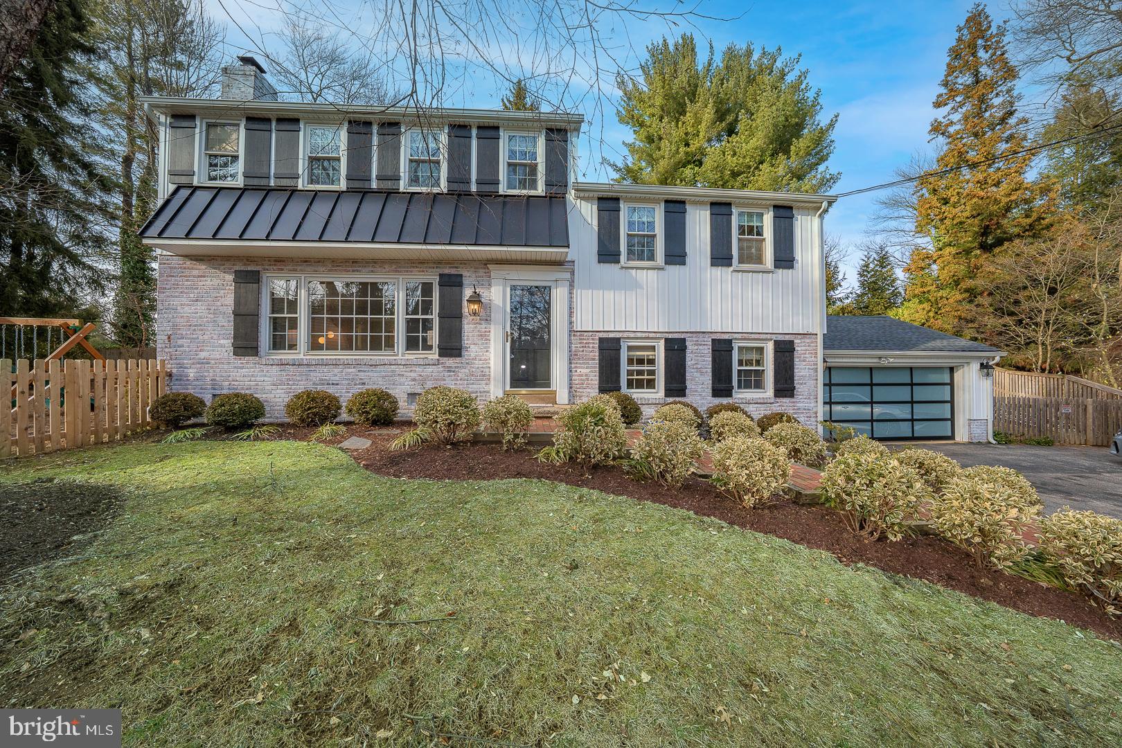 429 Conestoga Road Wayne, PA 19087 - Photo 1 of 33 a front view of a house with garden