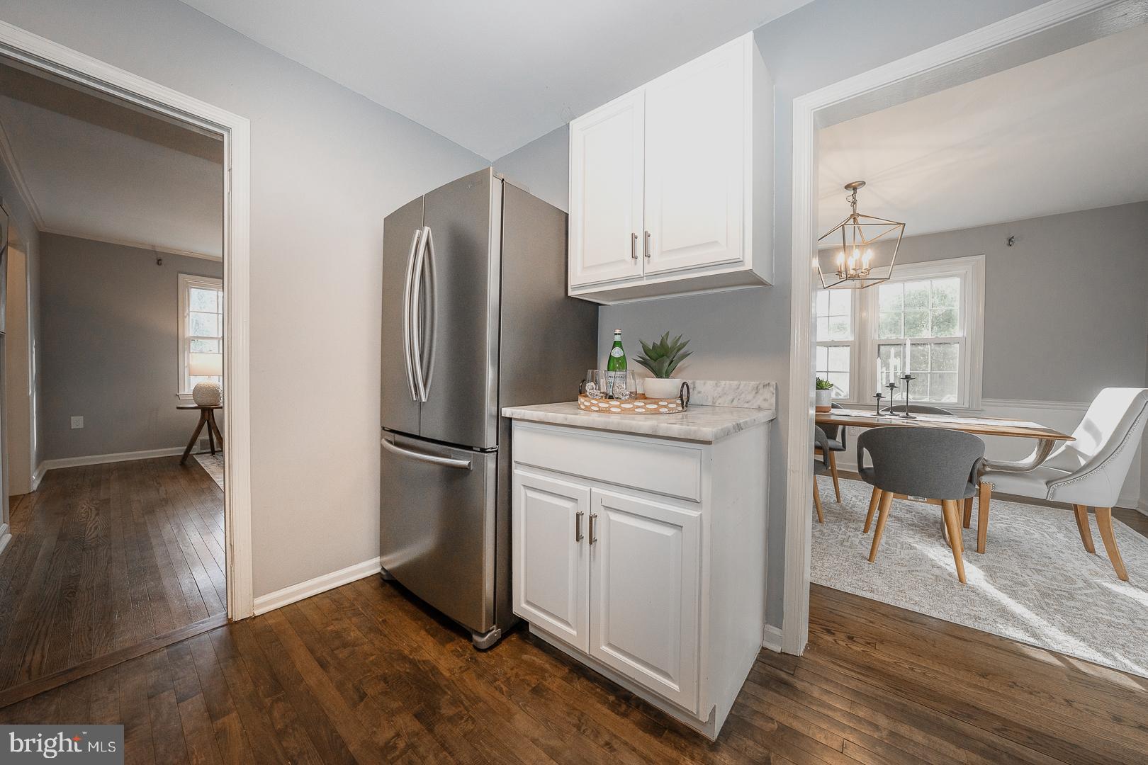 429 Conestoga Road Wayne, PA 19087 - Photo 11 of 33 a kitchen with a refrigerator cabinets and wooden floor