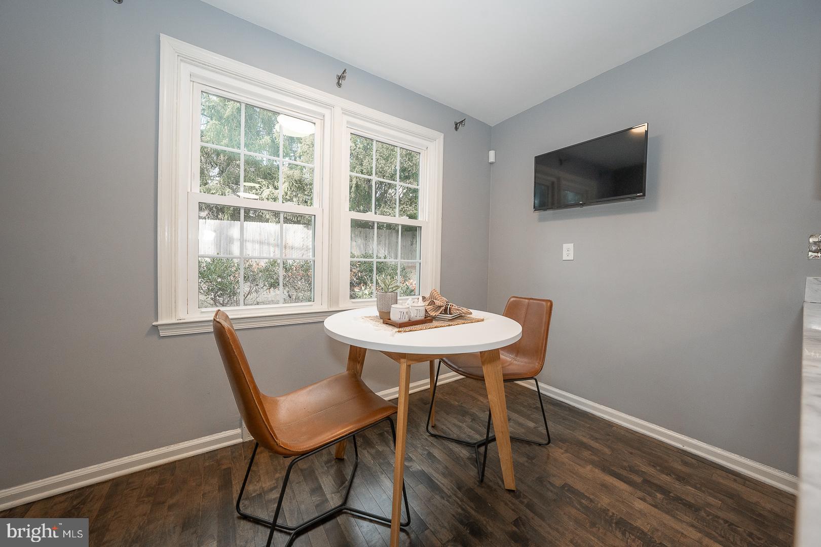 429 Conestoga Road Wayne, PA 19087 - Photo 12 of 33 a view of a dining room with furniture and wooden floor