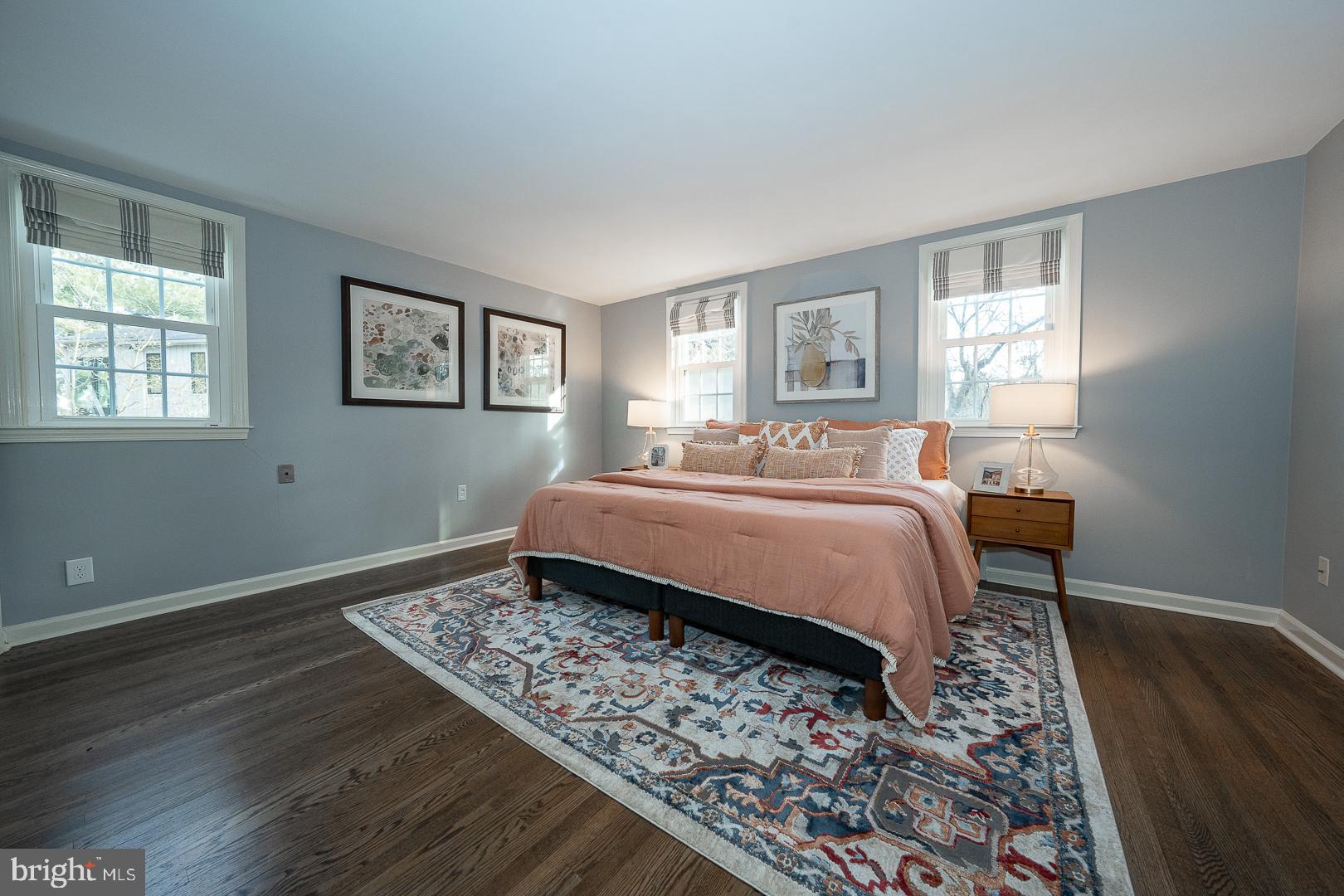 429 Conestoga Road Wayne, PA 19087 - Photo 13 of 33 a bedroom with a bed and wooden floor