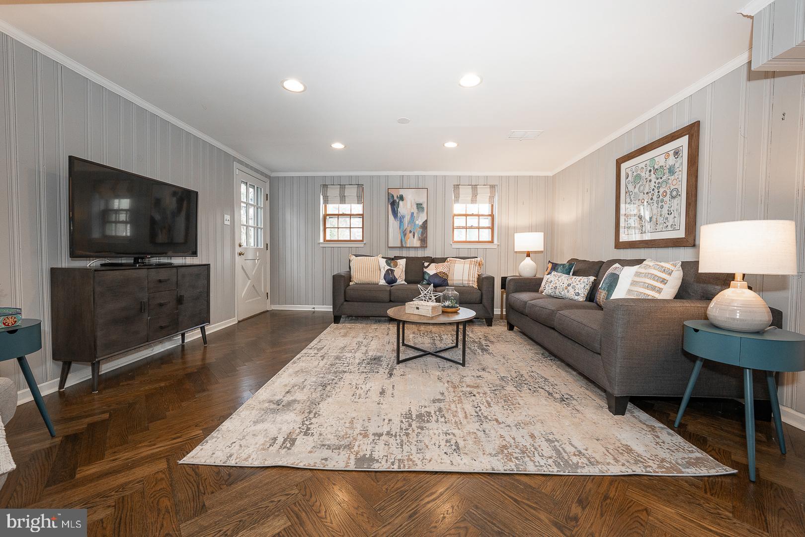 429 Conestoga Road Wayne, PA 19087 - Photo 25 of 33 a living room with furniture and a flat screen tv