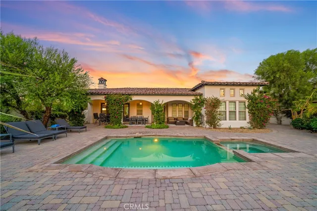 an aerial view of residential house and sandy dunes