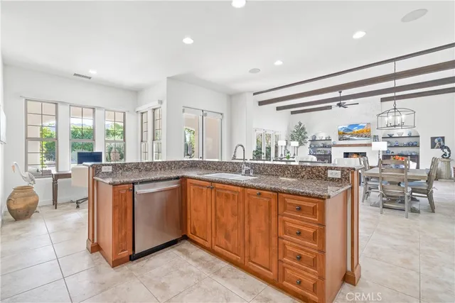 a kitchen with stainless steel appliances granite countertop a stove and large sink