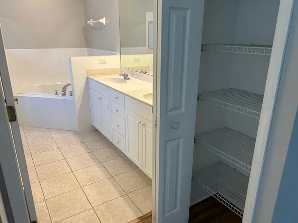 a bathroom with a bathtub and a sink