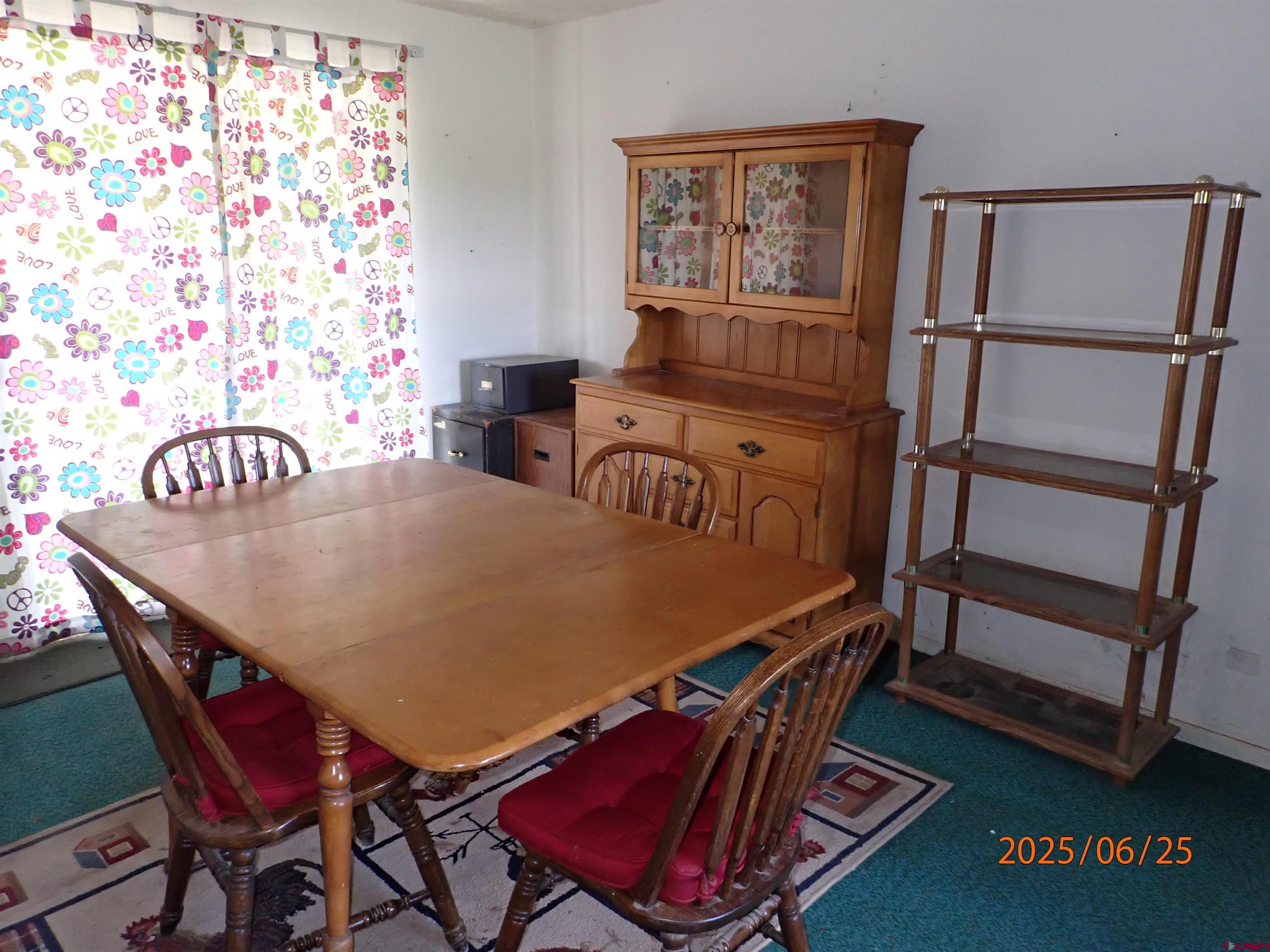 21391 Kaiser Road Austin, CO 81410 - Photo 3 of 12 a dining room with furniture and wooden floor