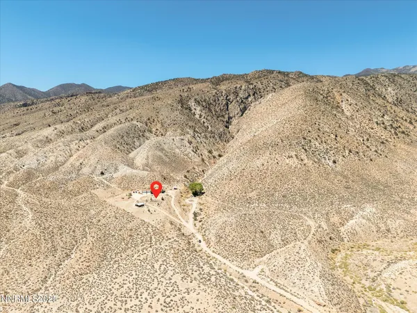 a view of a backyard of the house