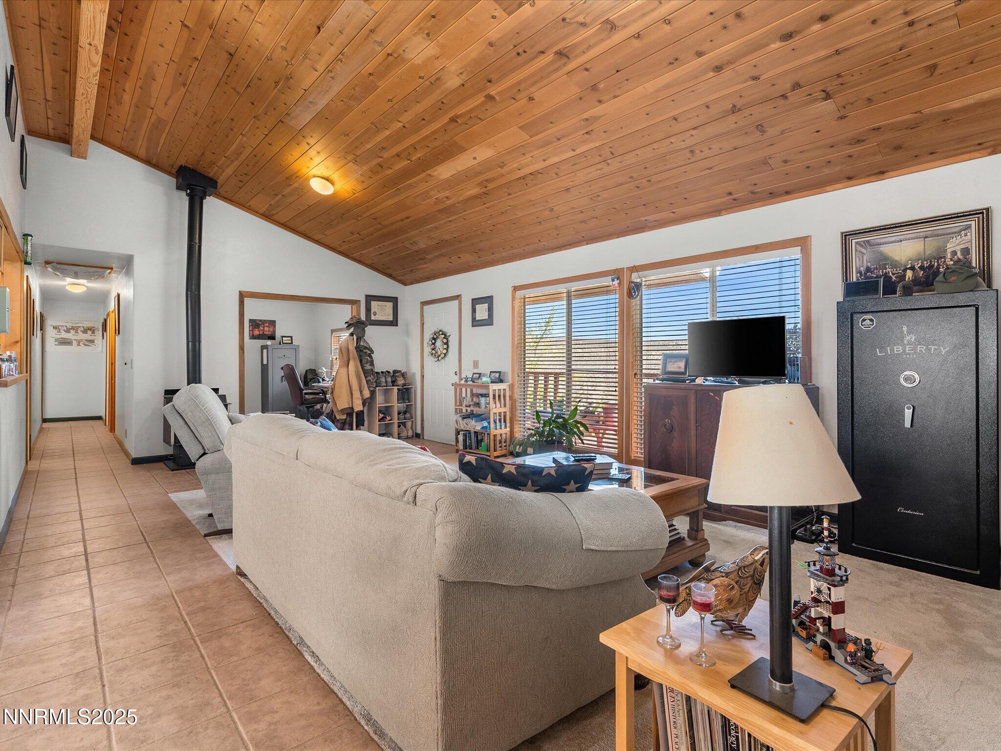 1 Cory Canyon Road Hawthorne, NV 89415 - Photo 15 of 77 a living room with furniture a large window and a chandelier