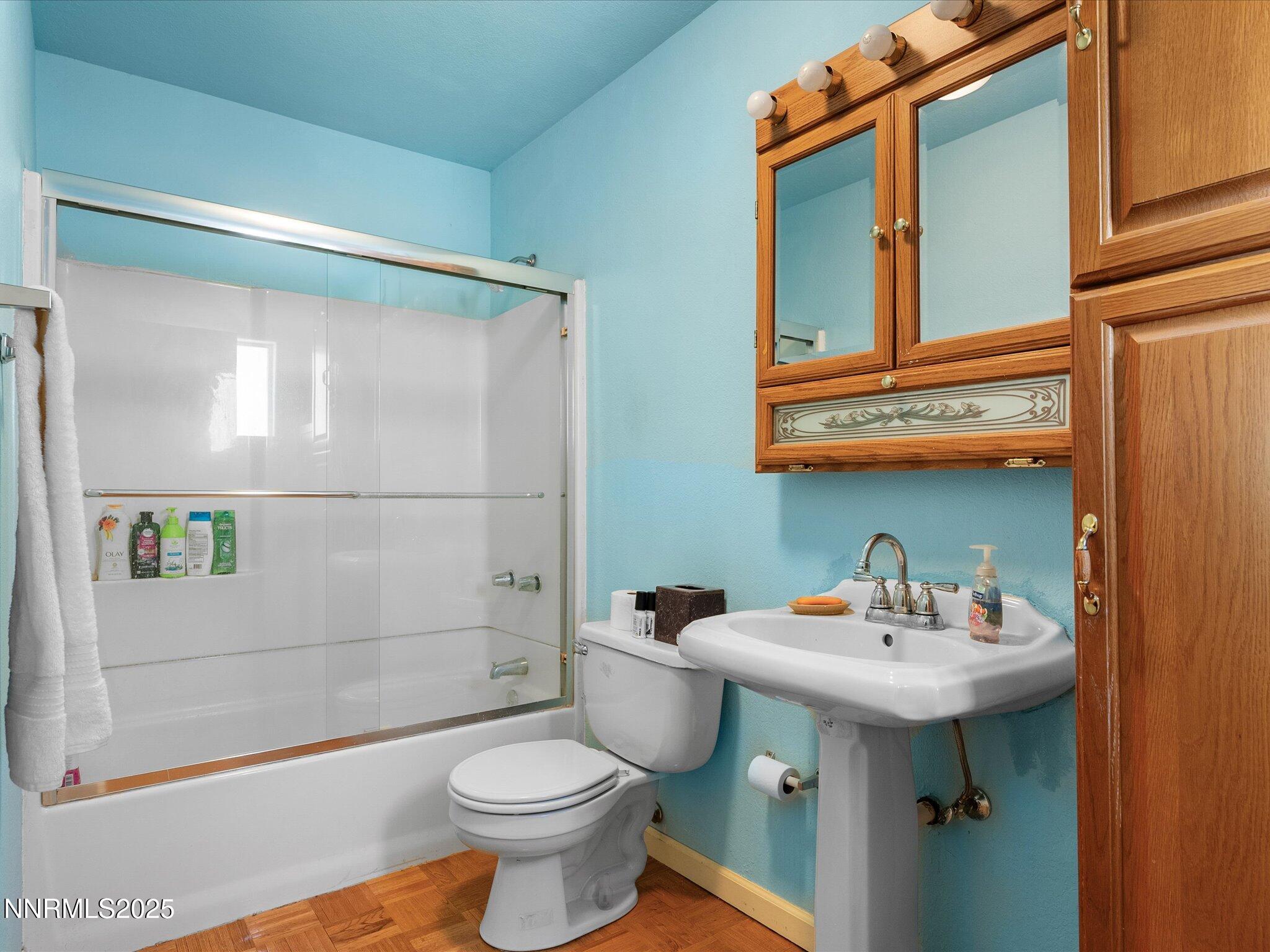 1 Cory Canyon Road Hawthorne, NV 89415 - Photo 25 of 77 a bathroom with a sink mirror toilet and shower