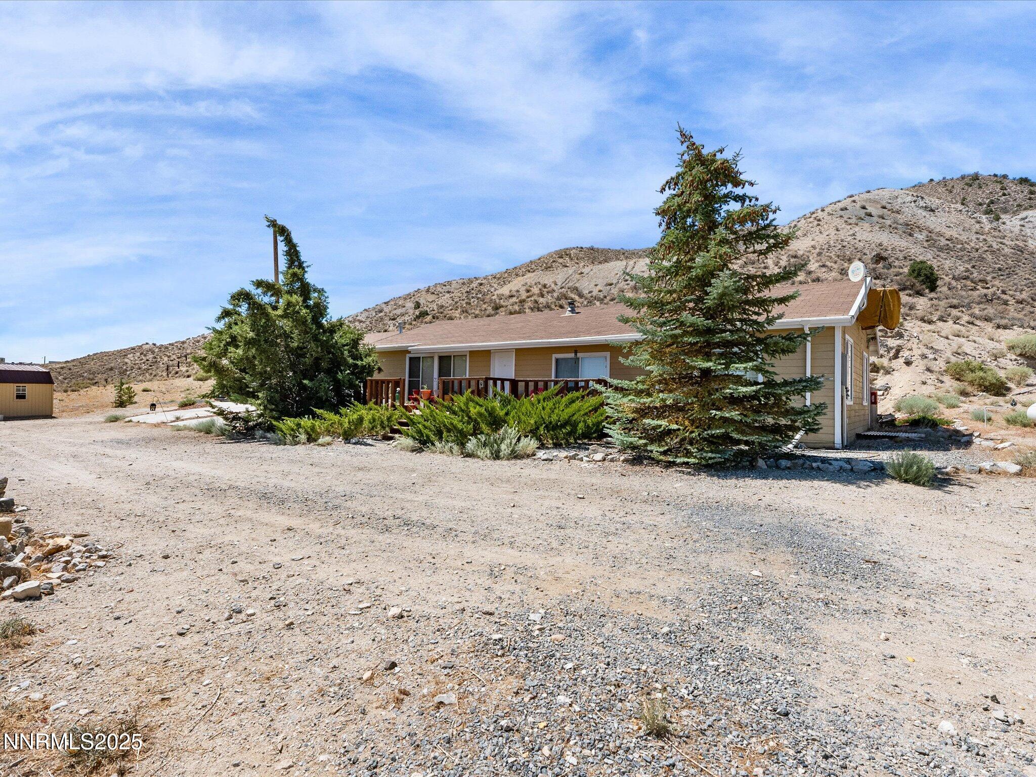 1 Cory Canyon Road Hawthorne, NV 89415 - Photo 3 of 77 a front view of a house with a yard and garage