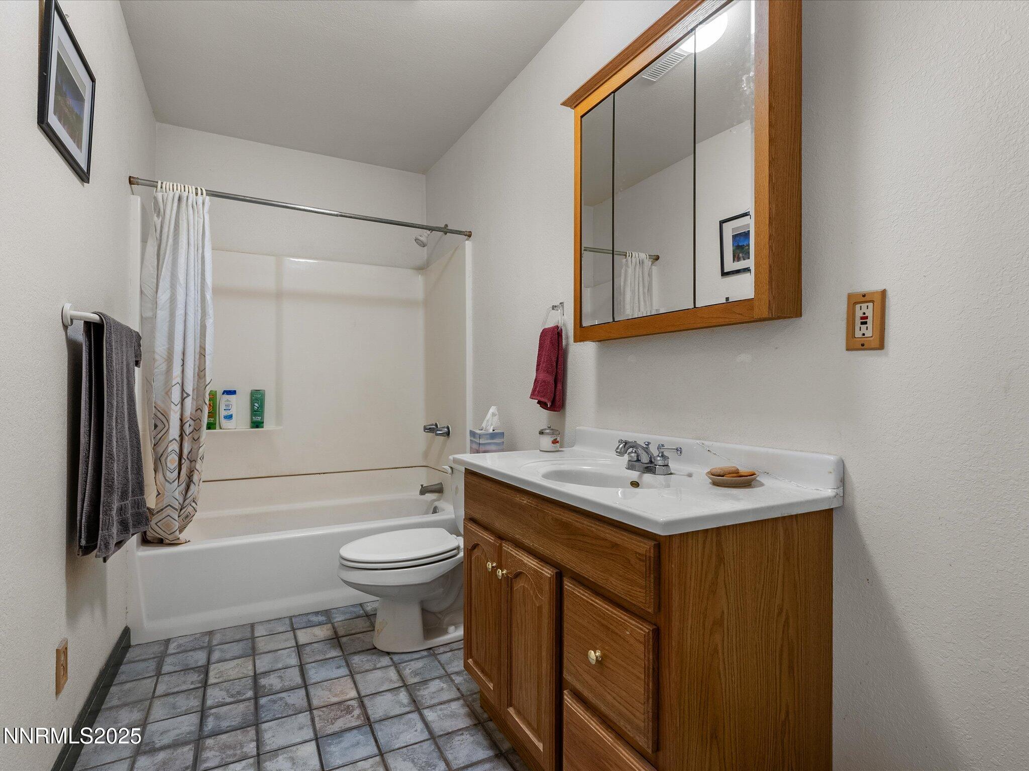1 Cory Canyon Road Hawthorne, NV 89415 - Photo 31 of 77 a bathroom with a sink a toilet and a mirror