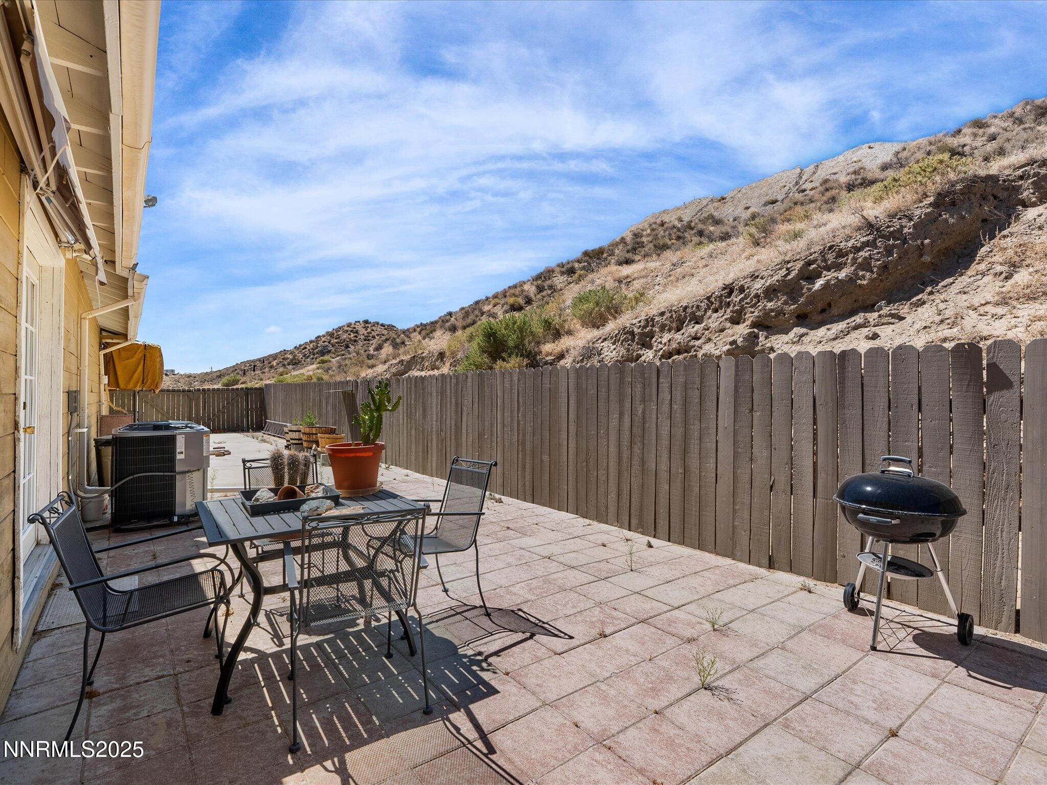 1 Cory Canyon Road Hawthorne, NV 89415 - Photo 34 of 77 a backyard of a house with table and chairs