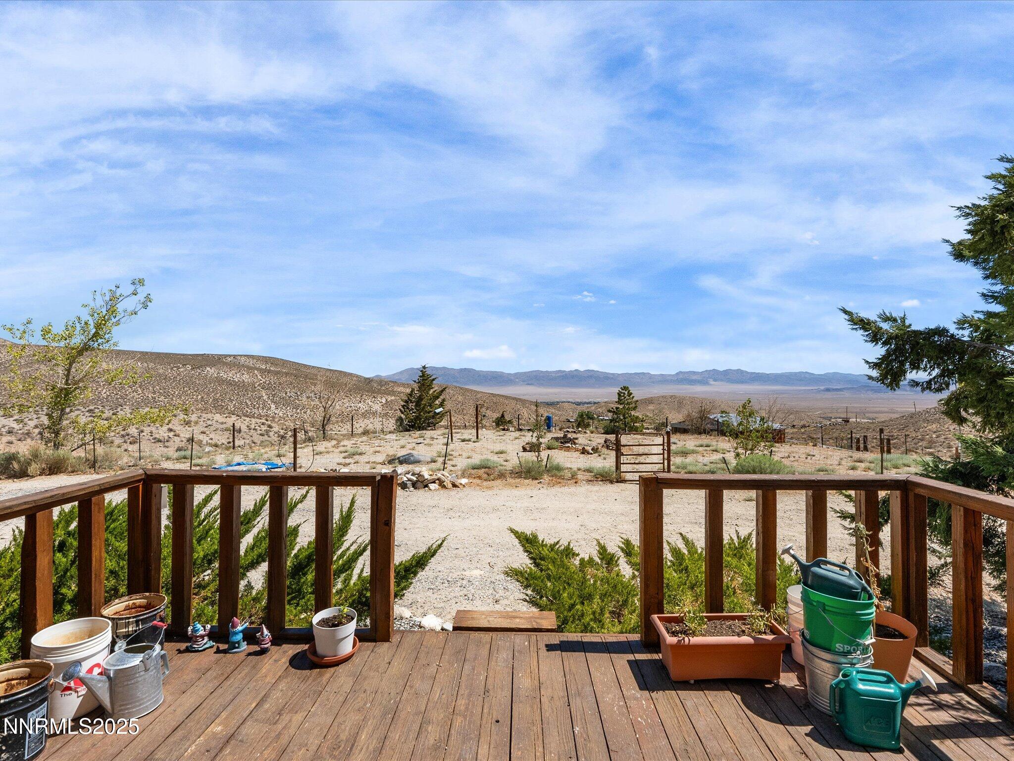 1 Cory Canyon Road Hawthorne, NV 89415 - Photo 9 of 77 a view of a balcony with wooden chairs and city view