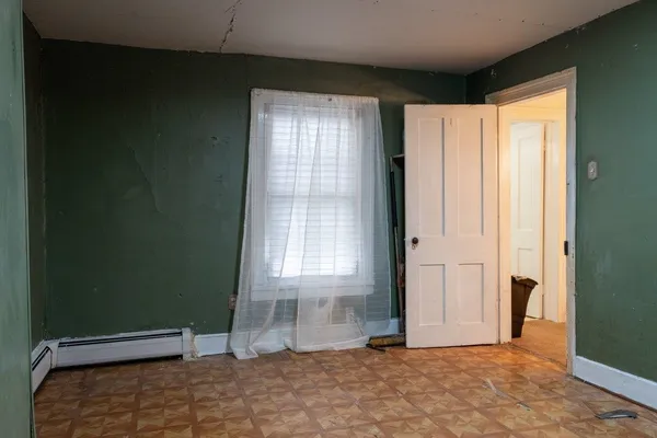 a view of a livingroom with wooden floor