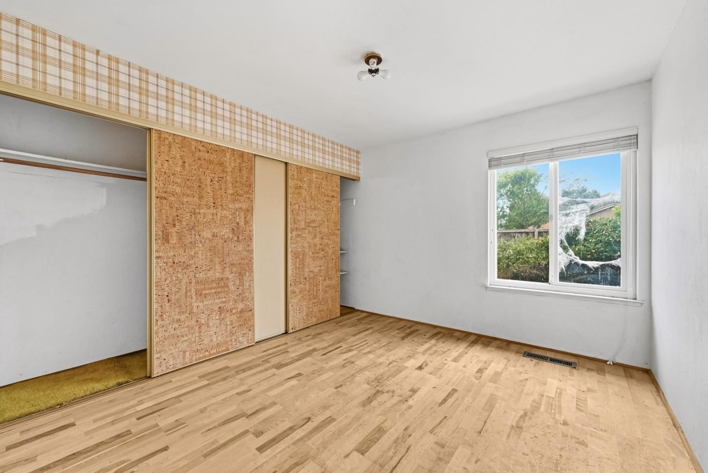 45811 Cheyenne Place Fremont, CA 94539 - Photo 27 of 44 an empty room with wooden floor and windows