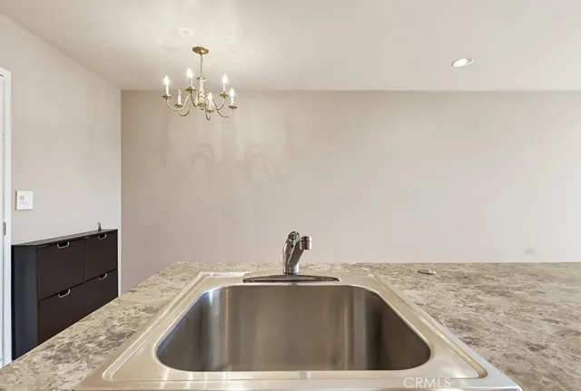 a kitchen with a sink and cabinets