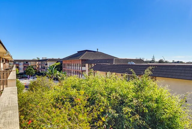 a view of a patio with a table and chairs