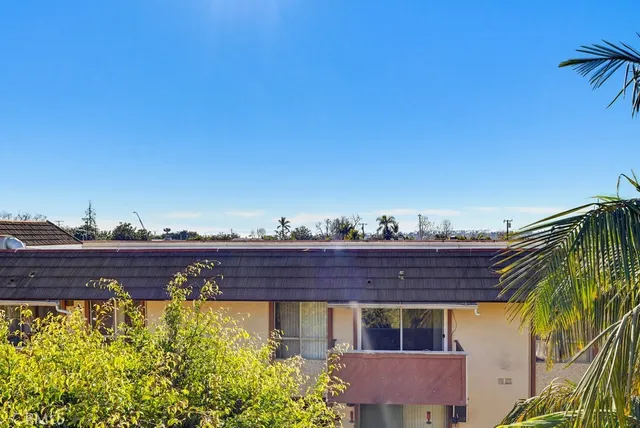 a backyard of a house with outdoor seating