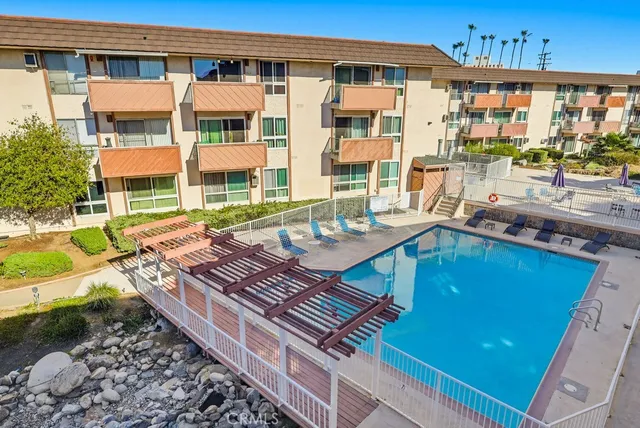 a view of a dining room with furniture and a flat screen tv