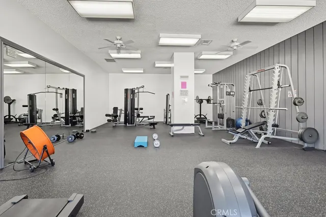 a view of a house with a yard and pathway