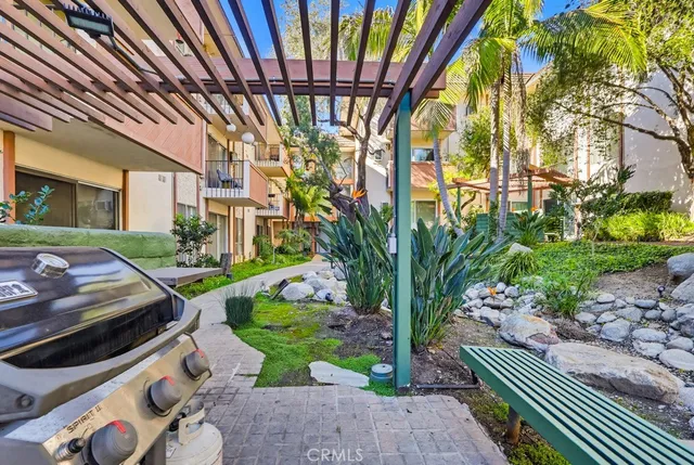 a front view of a building with outdoor seating