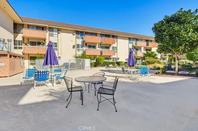 a view of swimming pool with outdoor seating