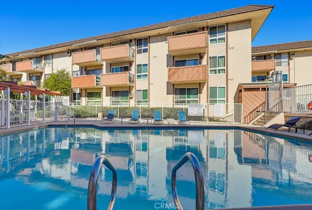 a view of a balcony with floor to ceiling windows with wooden floor