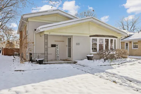 a view of a house with snow on the floor