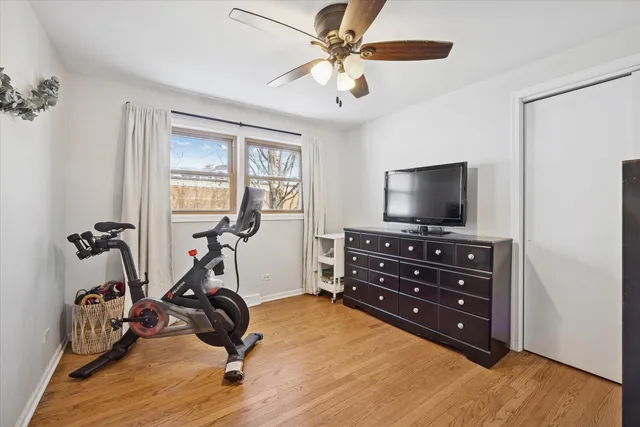 a room with gym equipment and a flat screen tv