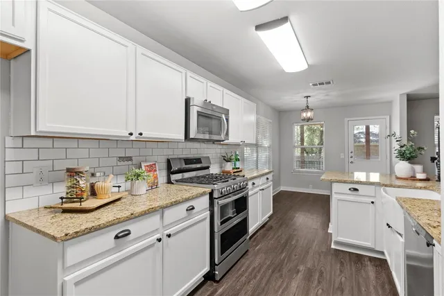 a view of a house with a yard balcony and furniture