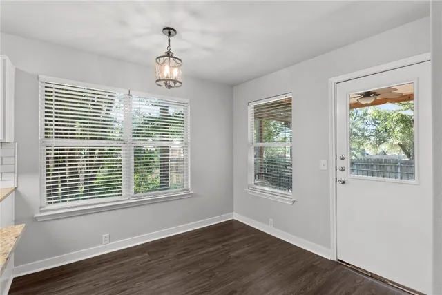a view of a balcony with wooden floor