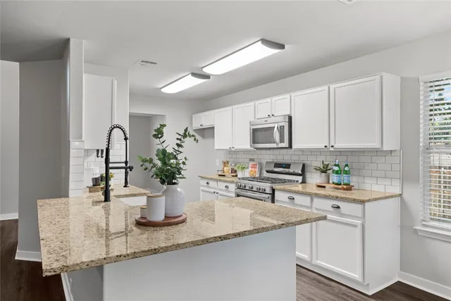 a view of a porch with wooden floor