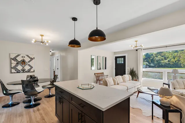 a view of a dining room with furniture window and outside view