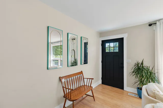 a view of a livingroom with furniture and a potted plant