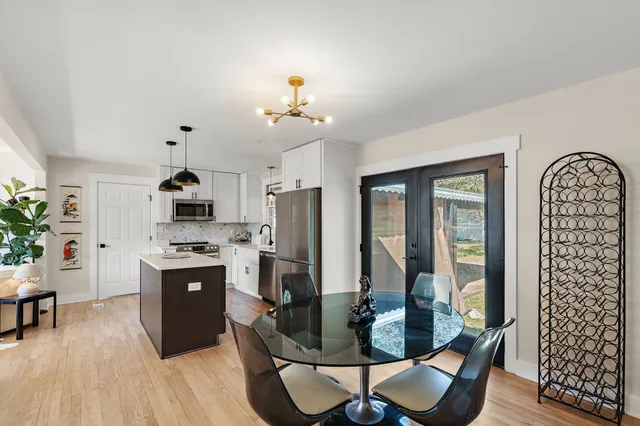 a kitchen with stainless steel appliances granite countertop a stove and a refrigerator
