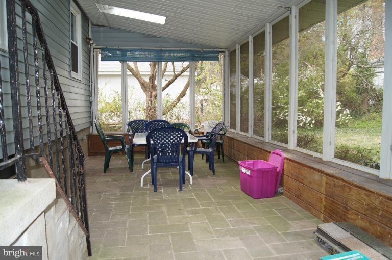 1002 Litchfield Road Baltimore, MD 21239 - Photo 2 of 30 Huge screened porch off kitchen.