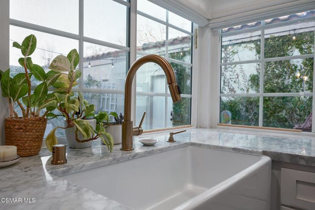 a bath tub sitting next to a window