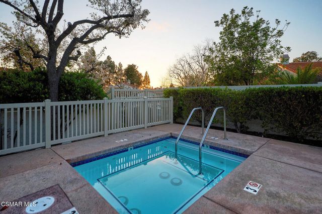 a view of a backyard with sitting area